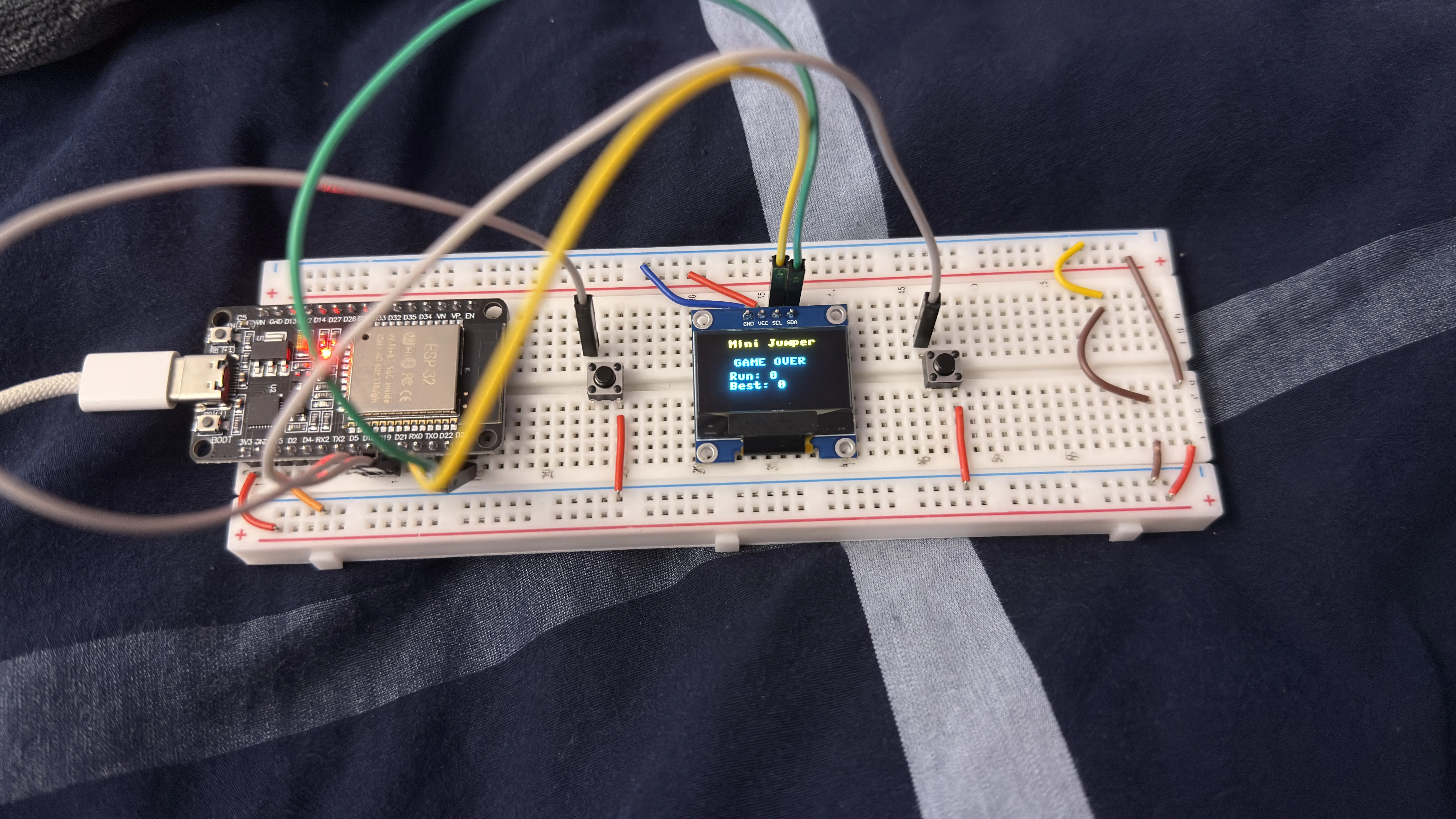 ESP32 game prototype built on a breadboard for electronics prototyping.